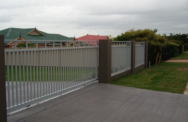 Grey aluminium sliding gate and matching fence